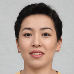 Joyful asian young-adult female with short  black hair and brown eyes