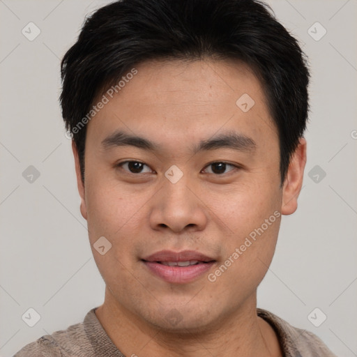 Joyful asian young-adult male with short  brown hair and brown eyes