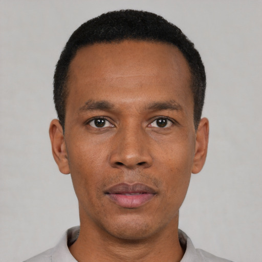 Neutral black young-adult male with short  black hair and brown eyes