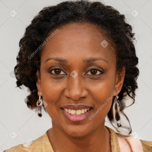 Joyful black adult female with medium  brown hair and brown eyes