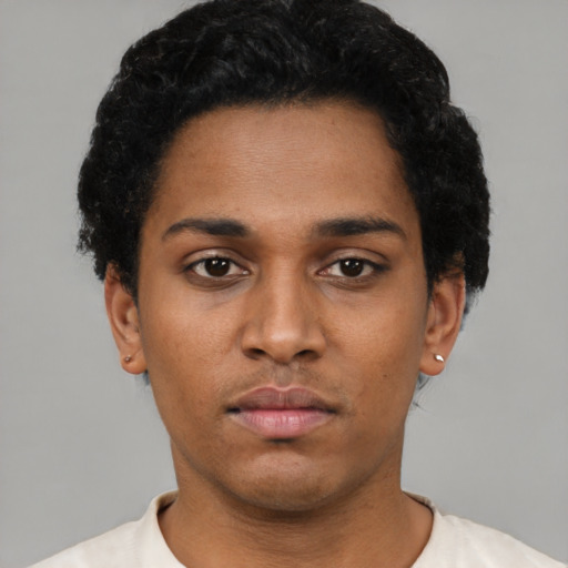 Neutral black young-adult male with short  black hair and brown eyes
