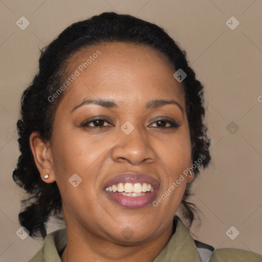 Joyful black adult female with medium  brown hair and brown eyes