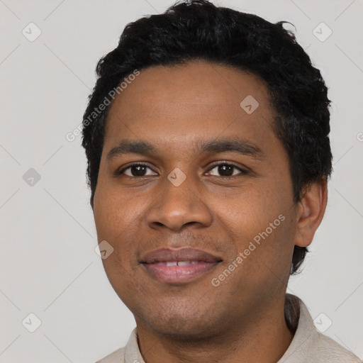 Joyful black young-adult male with short  black hair and brown eyes