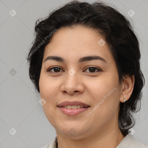 Joyful latino young-adult female with medium  brown hair and brown eyes