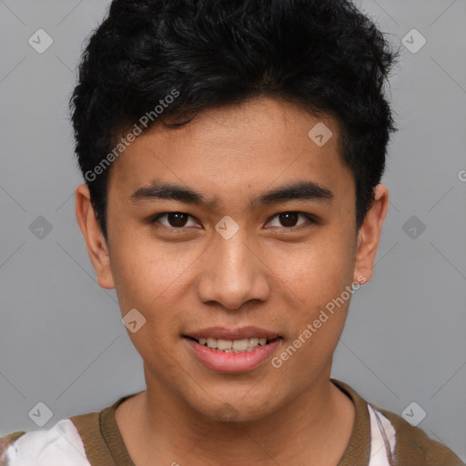 Joyful asian young-adult male with short  black hair and brown eyes