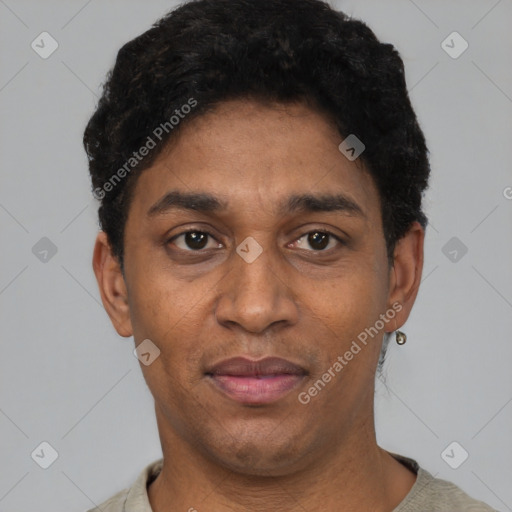 Joyful black young-adult male with short  black hair and brown eyes