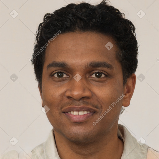 Joyful black young-adult male with short  black hair and brown eyes