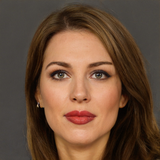 Joyful white young-adult female with long  brown hair and green eyes