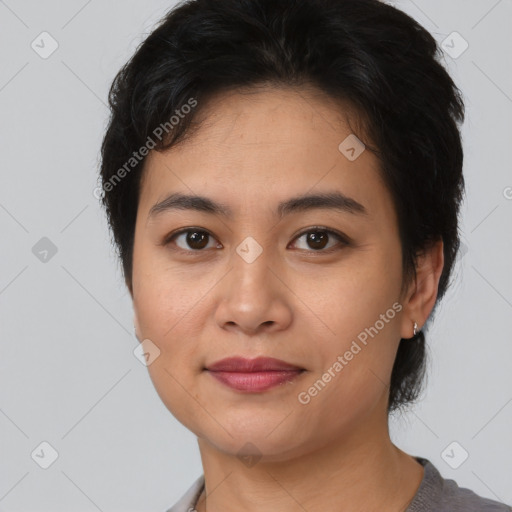 Joyful asian young-adult female with short  brown hair and brown eyes