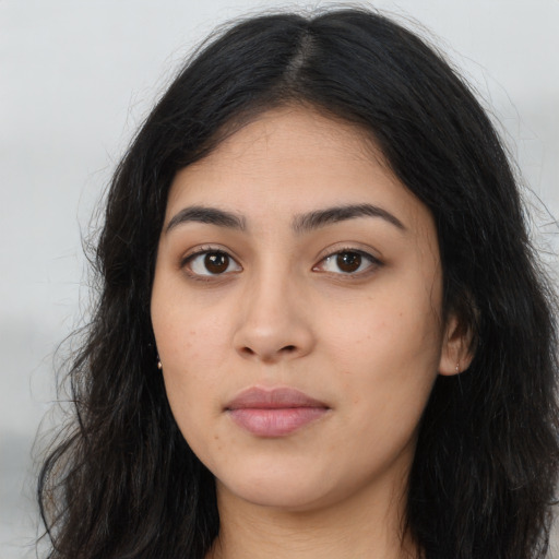 Neutral latino young-adult female with long  black hair and brown eyes