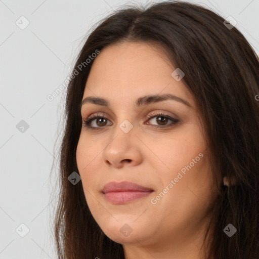 Joyful white young-adult female with long  brown hair and brown eyes