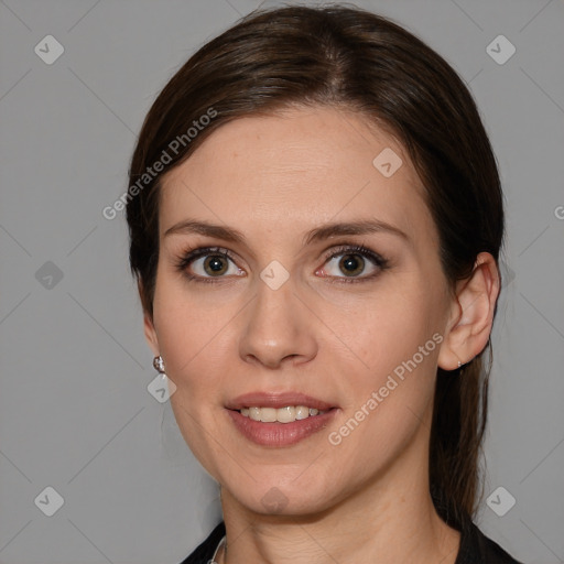 Joyful white young-adult female with medium  brown hair and blue eyes