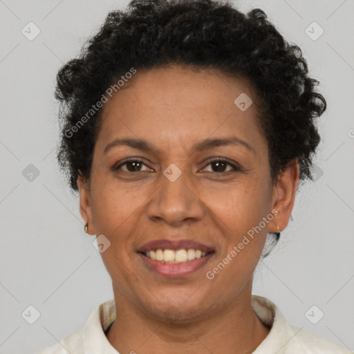 Joyful latino adult female with short  brown hair and brown eyes