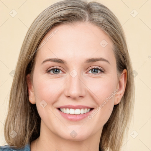 Joyful white young-adult female with medium  brown hair and blue eyes