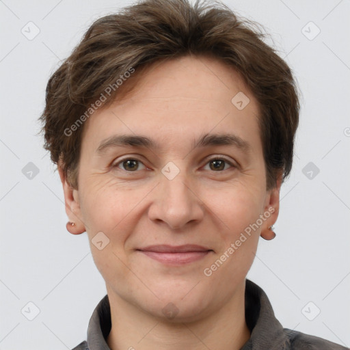 Joyful white adult female with short  brown hair and grey eyes