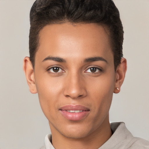 Joyful latino young-adult male with short  brown hair and brown eyes