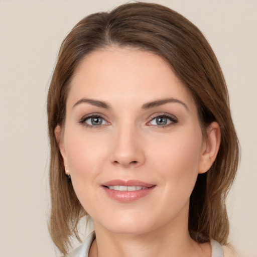 Joyful white young-adult female with medium  brown hair and brown eyes