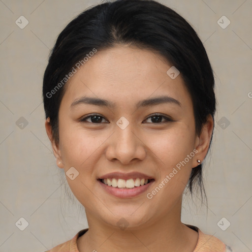 Joyful asian young-adult female with medium  brown hair and brown eyes