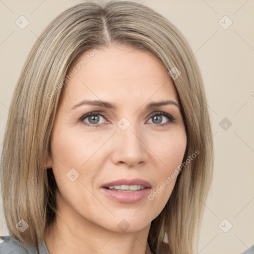 Joyful white adult female with medium  brown hair and grey eyes