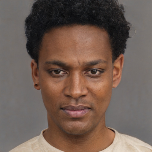 Neutral black young-adult male with short  black hair and brown eyes