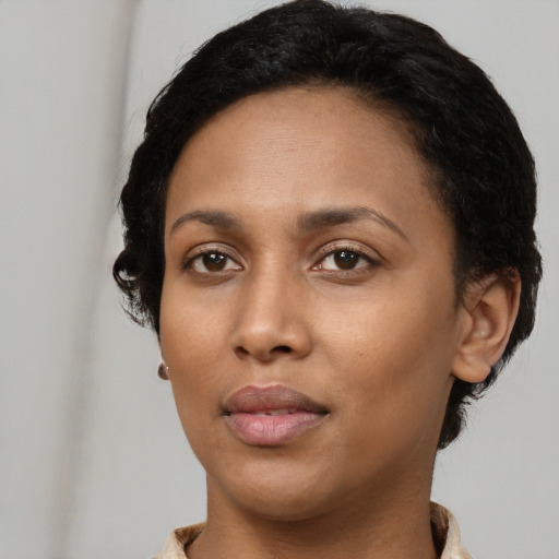 Neutral black young-adult female with short  black hair and brown eyes
