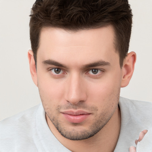 Neutral white young-adult male with short  brown hair and brown eyes