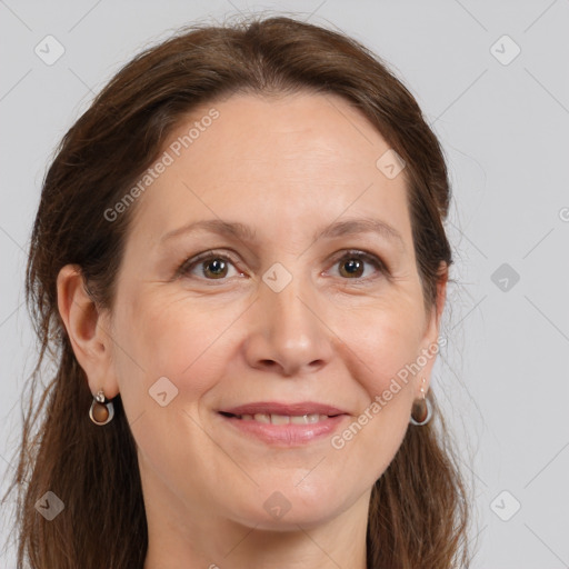 Joyful white adult female with long  brown hair and brown eyes