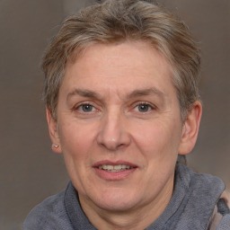 Joyful white middle-aged female with short  brown hair and brown eyes