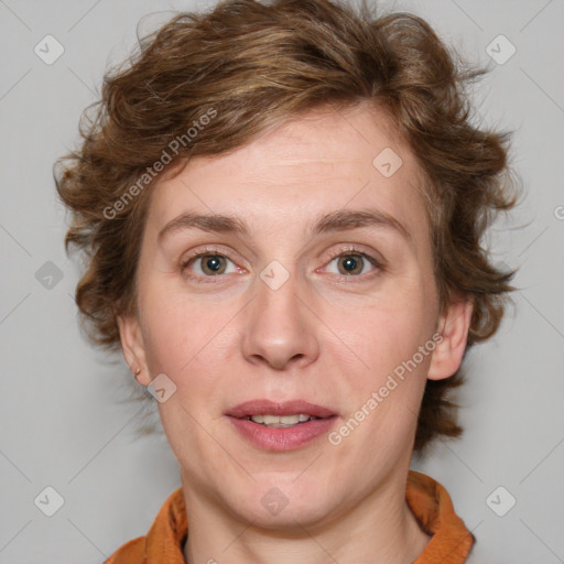 Joyful white adult female with medium  brown hair and blue eyes