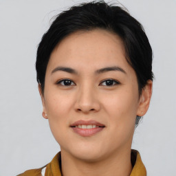 Joyful asian young-adult female with short  brown hair and brown eyes