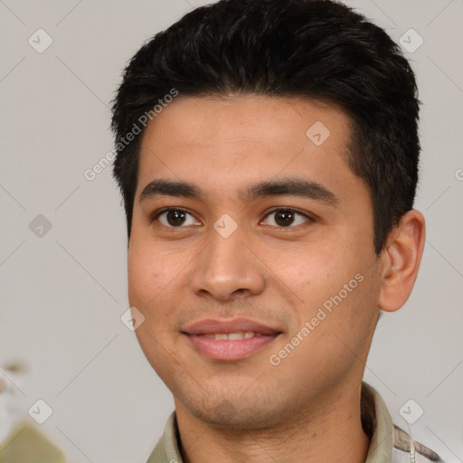 Joyful white young-adult male with short  black hair and brown eyes