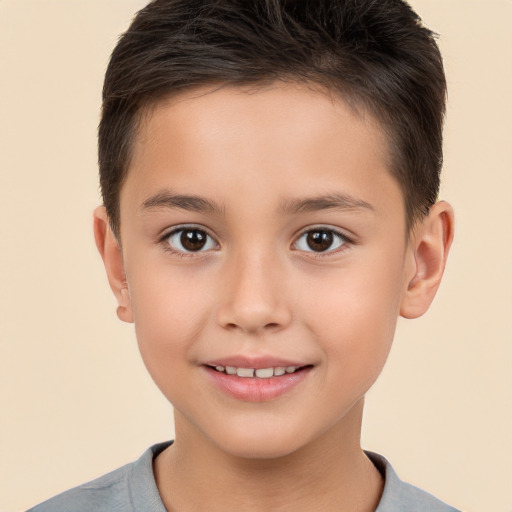 Joyful white child male with short  brown hair and brown eyes