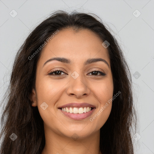 Joyful latino young-adult female with long  brown hair and brown eyes