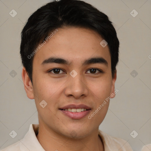 Joyful latino young-adult male with short  brown hair and brown eyes