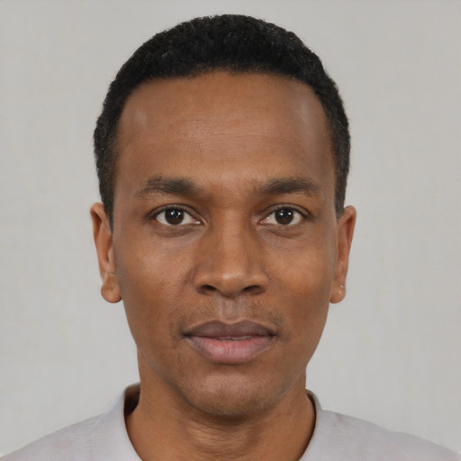 Neutral black young-adult male with short  black hair and brown eyes