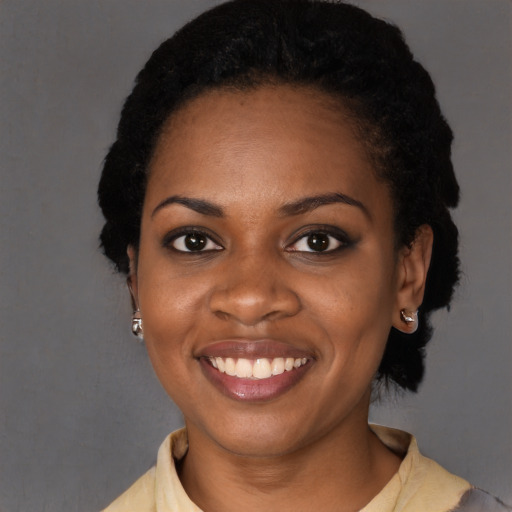 Joyful black young-adult female with medium  black hair and brown eyes