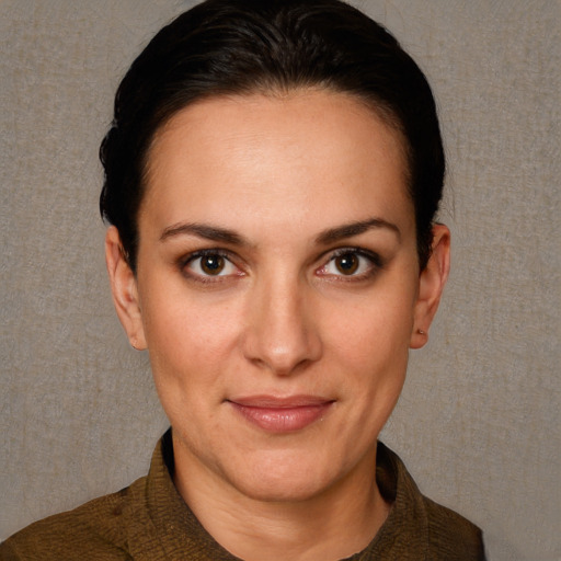 Joyful white adult female with short  brown hair and brown eyes