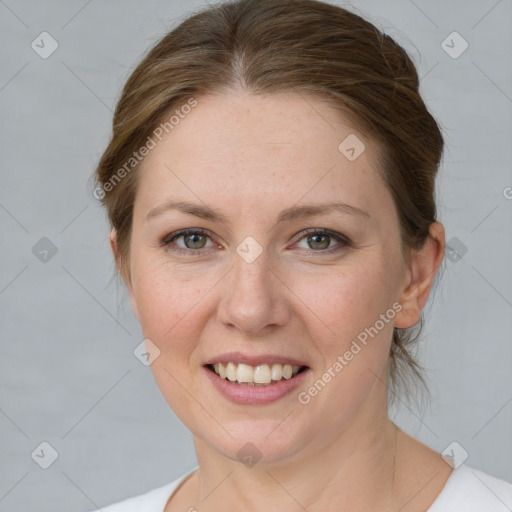 Joyful white adult female with medium  brown hair and grey eyes