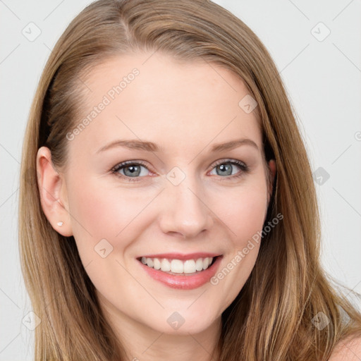 Joyful white young-adult female with long  brown hair and blue eyes