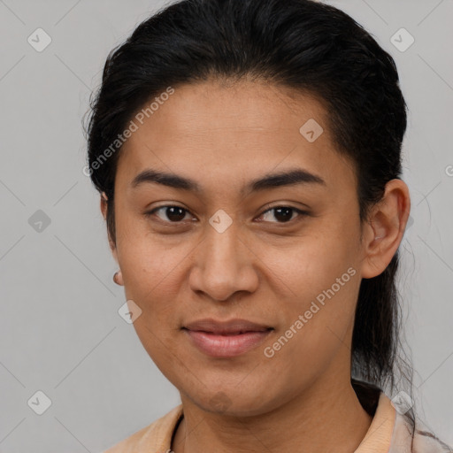 Joyful latino young-adult female with short  brown hair and brown eyes