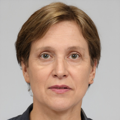 Joyful white adult female with medium  brown hair and grey eyes