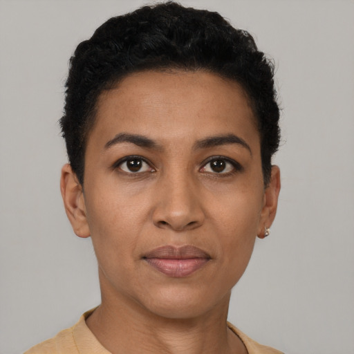 Joyful latino young-adult female with short  black hair and brown eyes