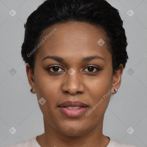 Joyful black young-adult female with short  black hair and brown eyes