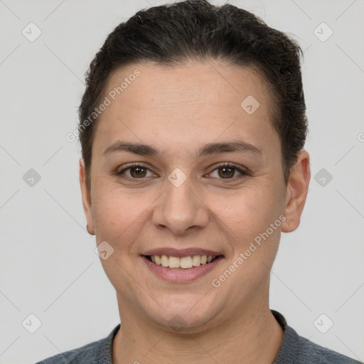 Joyful white young-adult female with short  brown hair and brown eyes