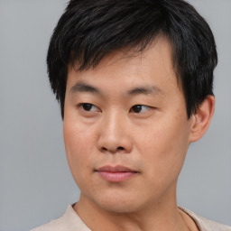 Neutral asian young-adult male with short  black hair and brown eyes