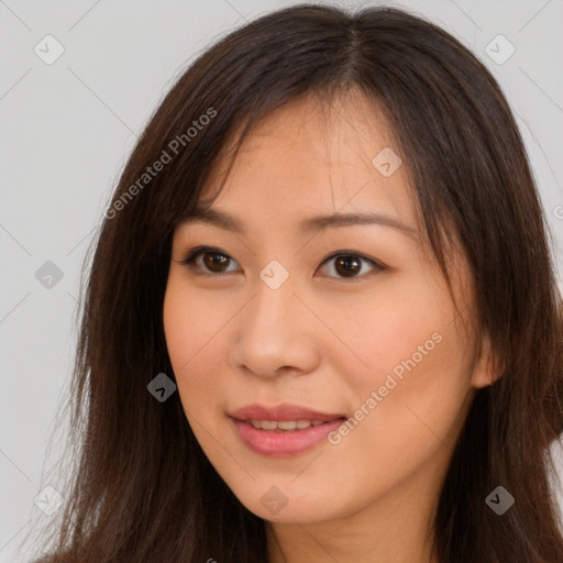 Joyful asian young-adult female with long  brown hair and brown eyes