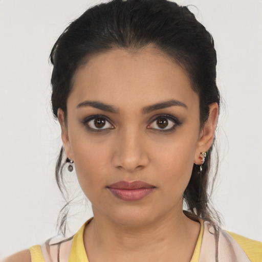 Neutral latino young-adult female with long  brown hair and brown eyes