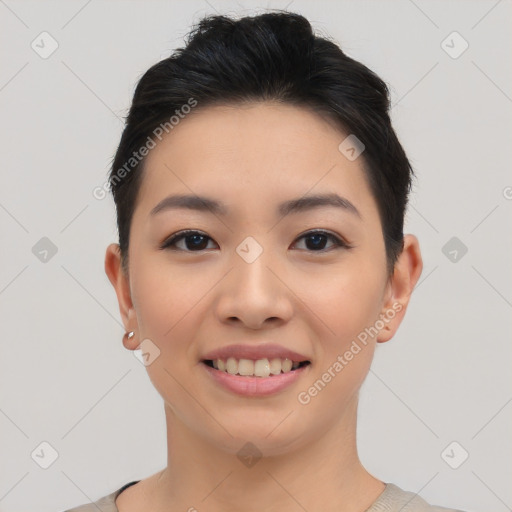 Joyful asian young-adult female with short  black hair and brown eyes