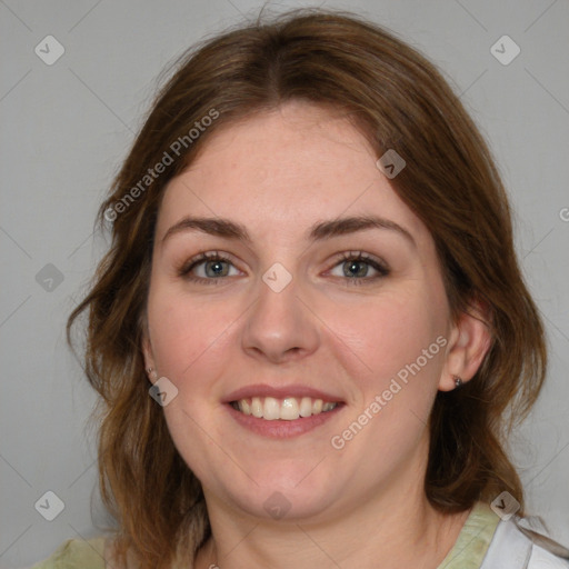 Joyful white young-adult female with medium  brown hair and blue eyes