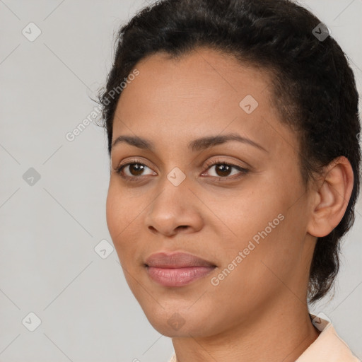 Joyful latino young-adult female with short  brown hair and brown eyes